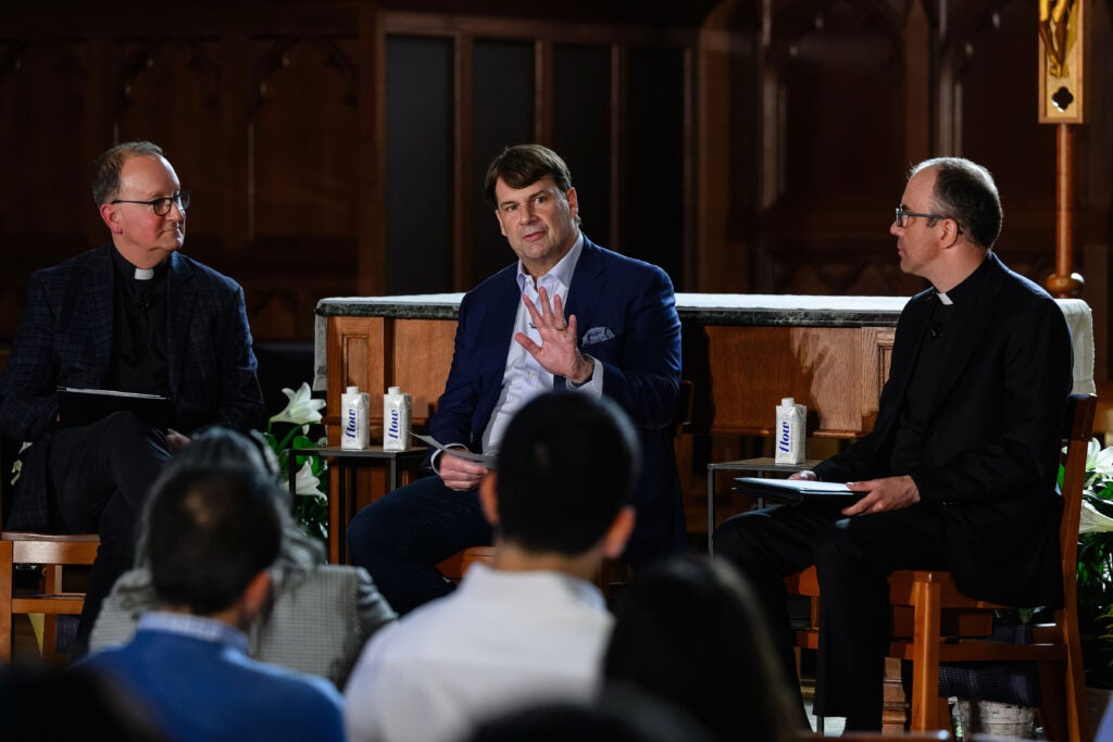 Ford Motor Company President and Chief Executive Officer, Jim Farley, Fr. Mark Bosco, and Fr. Quentin Dupont during a discussion. 