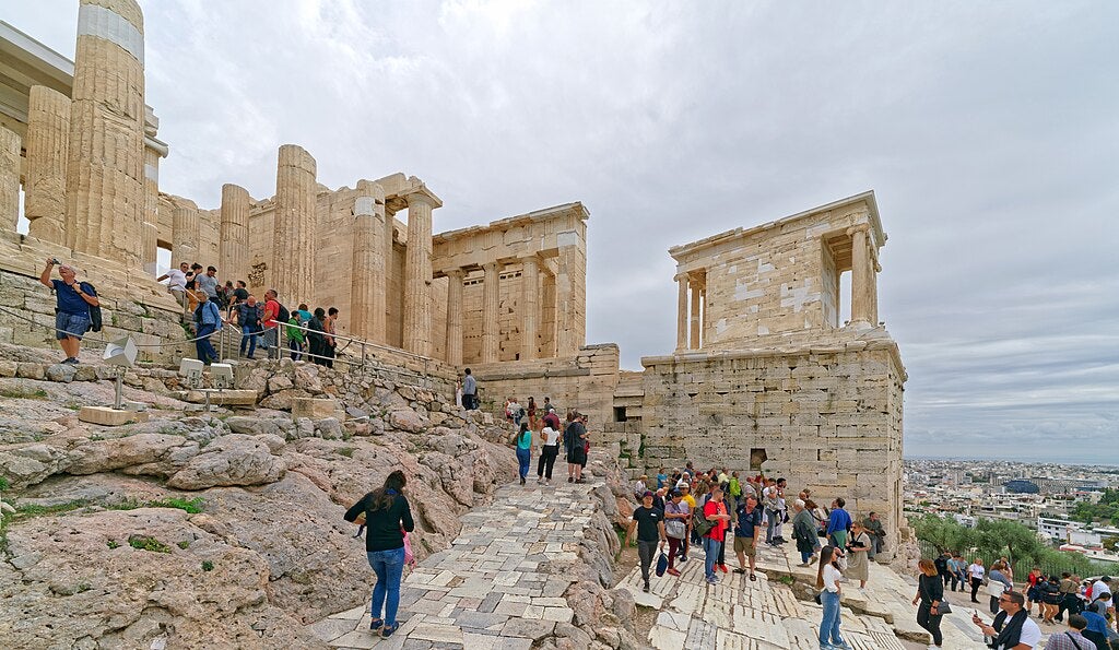 Tourists climbing the paths of the Acropolis in Greece. Photo by Wikimedia User:Holger Uwe Schmitt