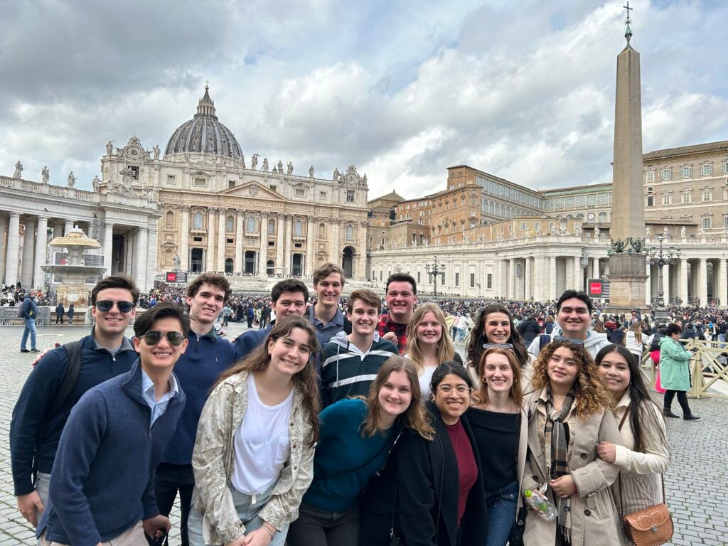 A group of students gathered for a group photo in St. Peter's Square in Vatican City.
